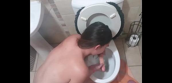  Human toilet bitch gets her face pissed on and lickssucks the toilet dildo clean and suck the dick